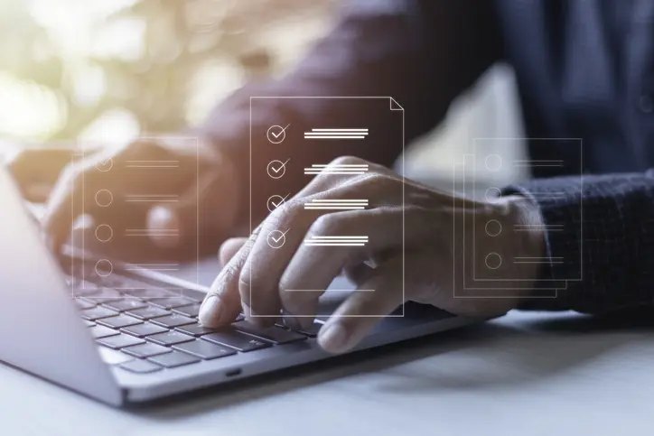 Document management system DMS, Assessment form, questionnaire, checklist, and clipboard task management, Businessman working on laptop computer productivity checklist and filling out a survey