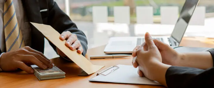 lawyer and client going over agreements