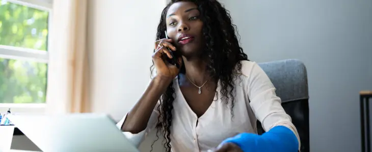 Broken Arm Injured Worker Compensation Coverage. Using Office Laptop