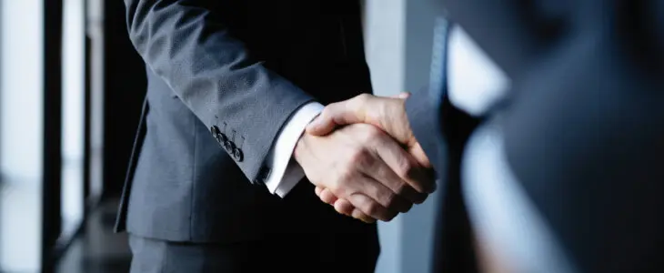 Business people shaking hands, finishing up a meeting