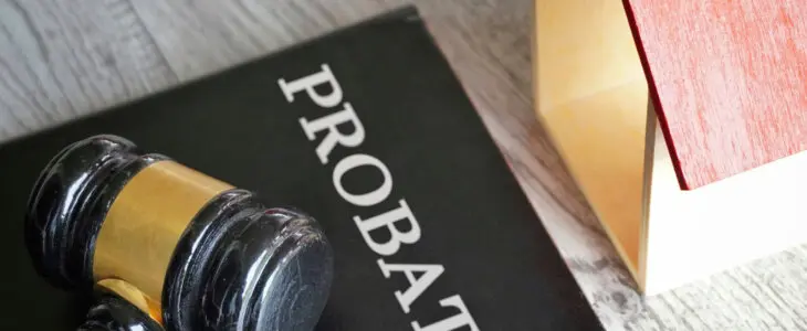 Toy house, gavel and text PROBATE. Real estate and law concept